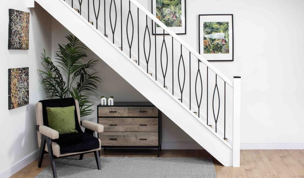 White staircase with black metal spindles